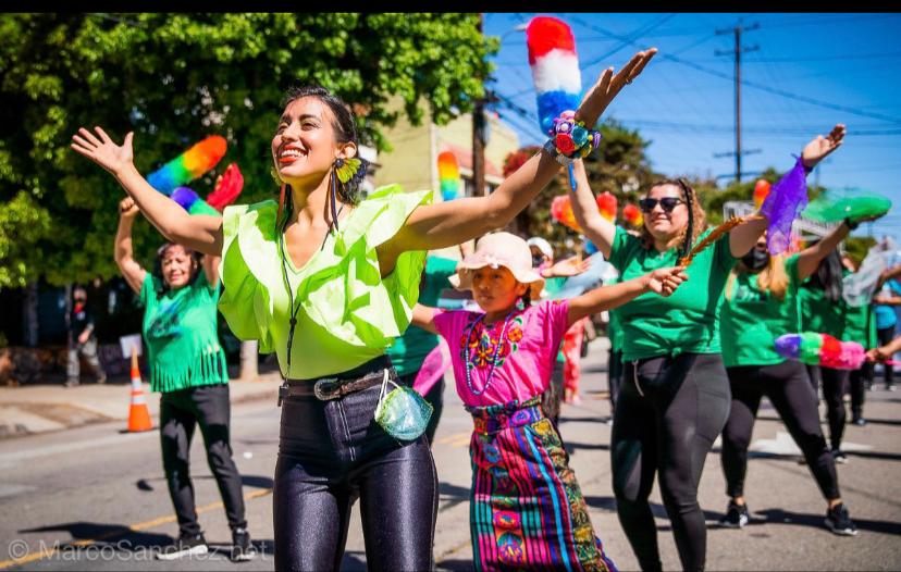 group of women dancing, walking down the street for carnival festival