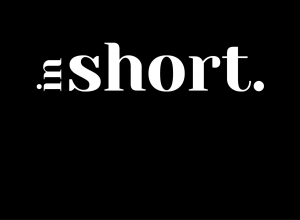 Black background with font in white of the Name of organization: In Short: A Journal of Flash Nonfiction